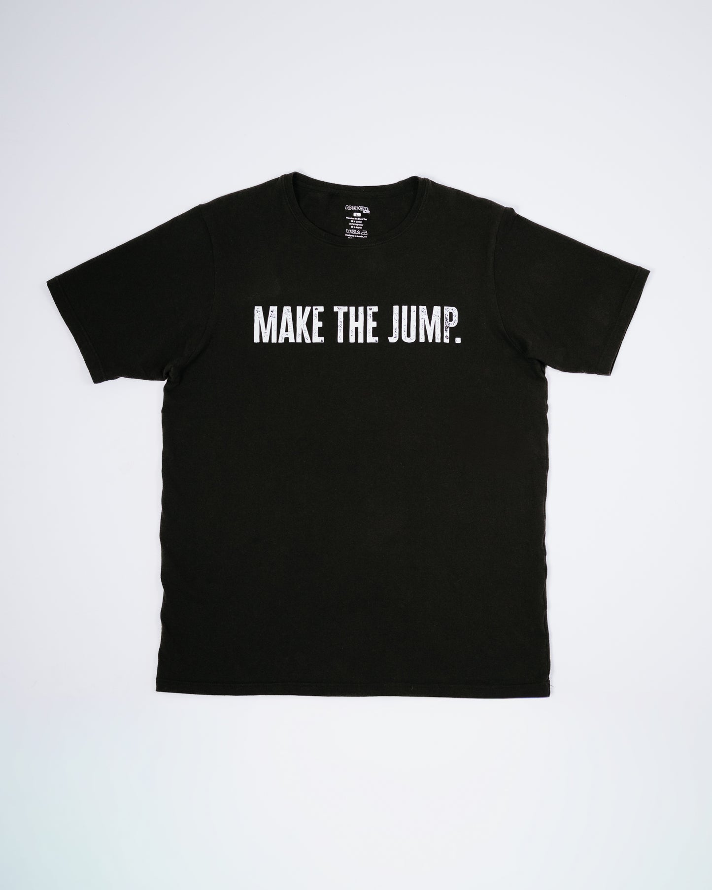 Black t-shirt with 'MAKE THE JUMP.' text on a white background