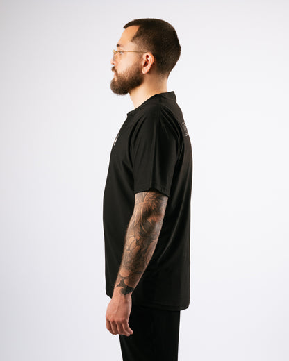 Man wearing a black t-shirt on a white background